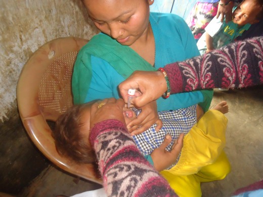 kid taking polio